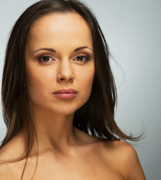 Cheerful beautiful young brunette woman with brown eyes and long hair — ストック写真