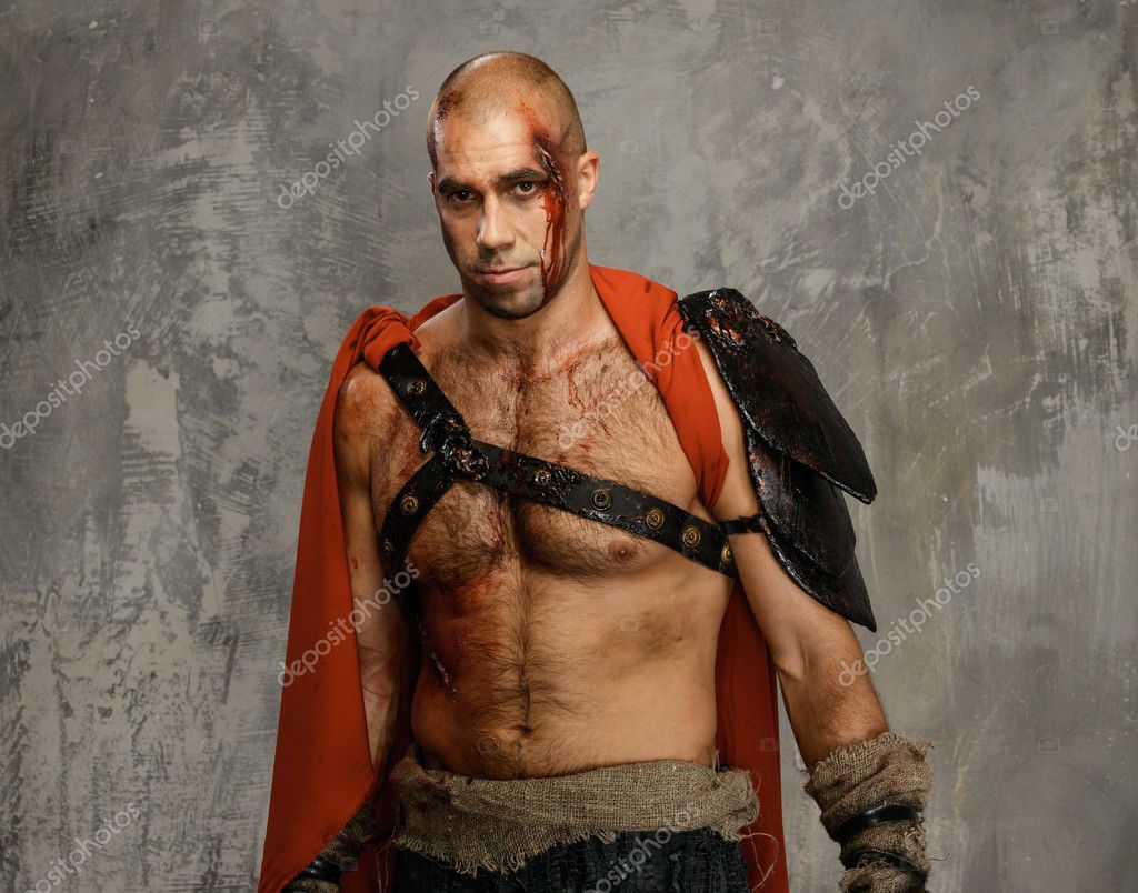 Wounded gladiator close-up Stock Photo by ©nejron 40761481