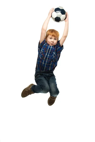 Little boy with soccer ball jumping — Stock Photo, Image