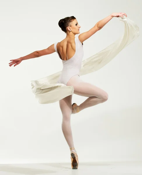 Young ballerina dancing with piece of silk fabric — Stock Photo, Image