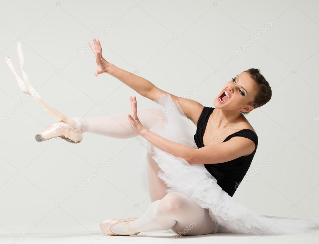 Regan krak pakke Young angry fed up ballerina dancer sitting on a floor Stock Photo by  ©nejron 41098201