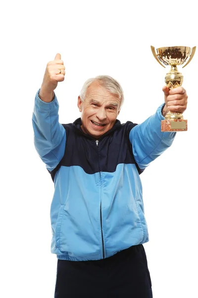 Senior man in opleiding pak met een prijs-kop — Stockfoto