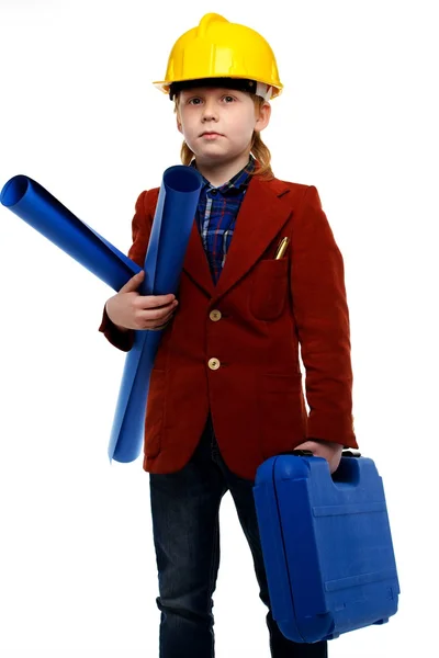 Мальчик с планами и инструментами, играющий роль инженера — стоковое фото
