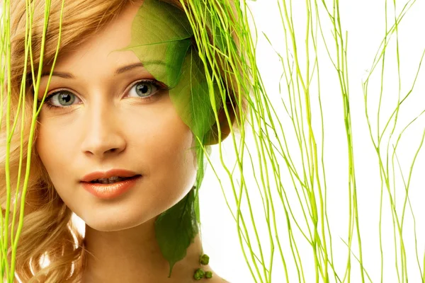 Beautiful young woman in conceptual spring costume Stock Image