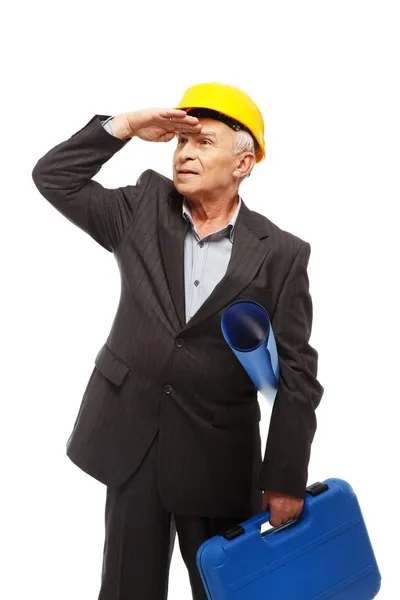 Ingénieur senior avec plan de chantier et différents outils — Photo