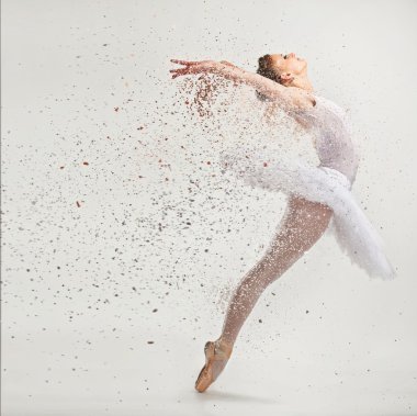 Young ballerina dancer in tutu performing on pointes  clipart