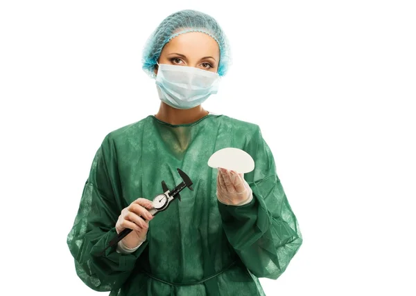 Plastic surgeon woman with silicon breast implants and calliper — Stock Photo, Image