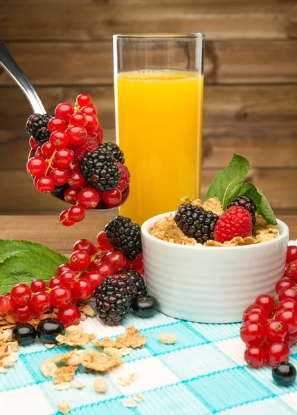 Healthy breakfast with fresh orange juice on tablecloth in wooden rural interior — Stock Photo, Image