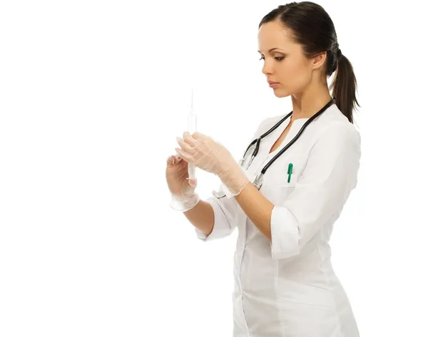 Young positive brunette doctor woman with syringe isolated on white Stock Photo