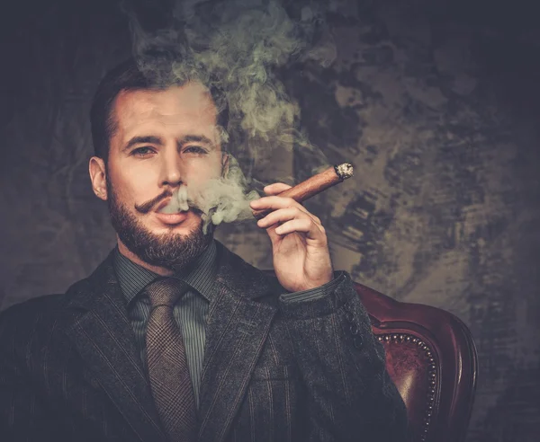 Handsome well-dressed with glass of beverage and cigar — Stock Photo, Image