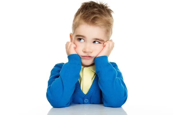 Thoughtful little boy in blue cardigan and yellow shirt — Stock Photo, Image