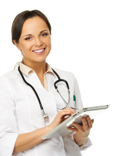 Young positive brunette doctor woman taking notes on tablet pc — Stock Photo, Image