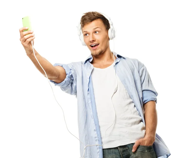 Elegante hombre feliz en auriculares tomando selfie aislado en blanco —  Fotos de Stock