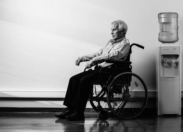 Thoughtful senior man in wheelchair in nursing home — Stock Photo, Image