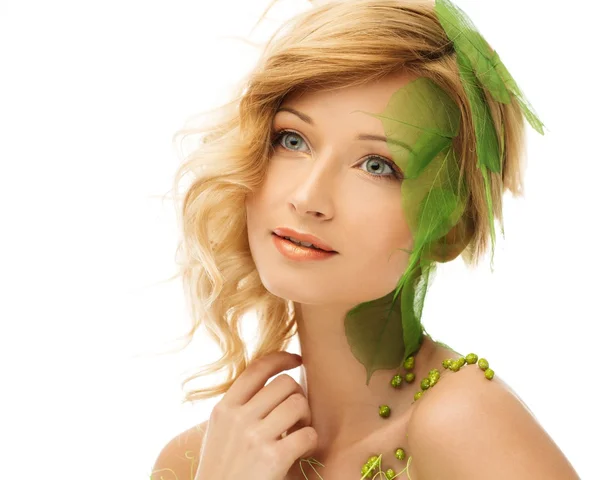 Beautiful young woman in conceptual spring costume touching her face — Stock Photo, Image