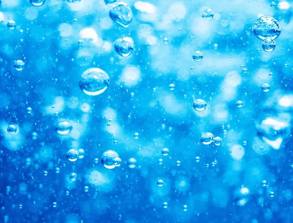 Blue water background with bubbles — Stock fotografie