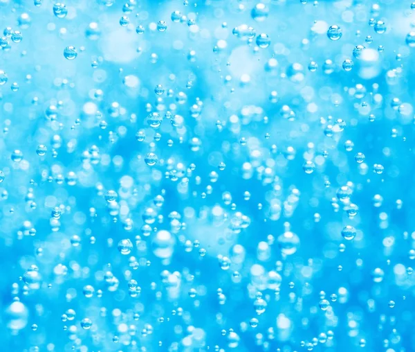 Blue water background with bubbles — Stockfoto