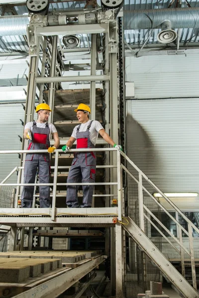 Two men  on a factory — Stock Photo, Image