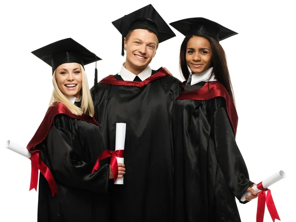 Grupo multiétnico de jóvenes estudiantes graduados aislados en blanco —  Fotos de Stock