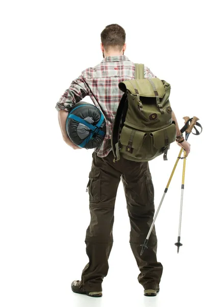 Traveler with backpack, hiking poles and sleeping bag — Stock Photo, Image