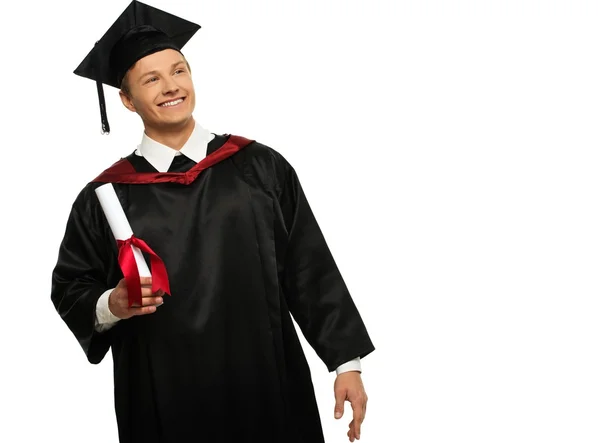 Alegre joven estudiante graduado aislado en blanco — Foto de Stock