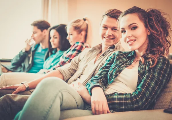 Group of multi ethnic young students preparing for exams in home interior — Stock Photo, Image