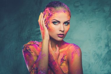 Beautiful young woman with conceptual colourful body art  clipart