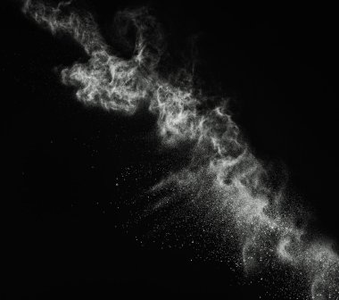 White powder exploding isolated on black clipart