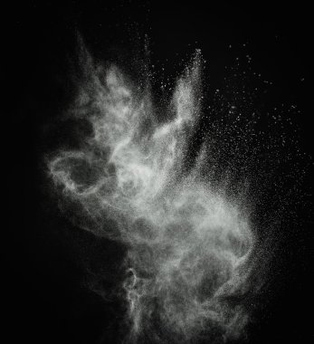 White powder exploding isolated on black clipart