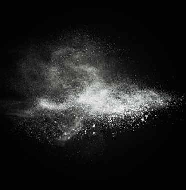 White powder exploding isolated on black clipart