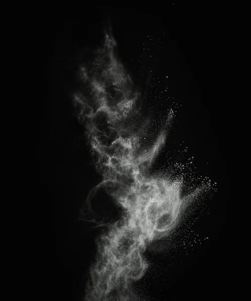 White powder exploding isolated on black — Stock Photo, Image