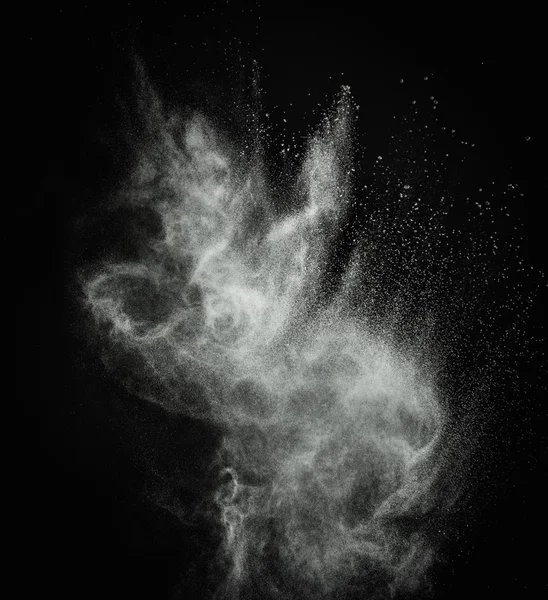 White powder exploding isolated on black — Stock Photo, Image