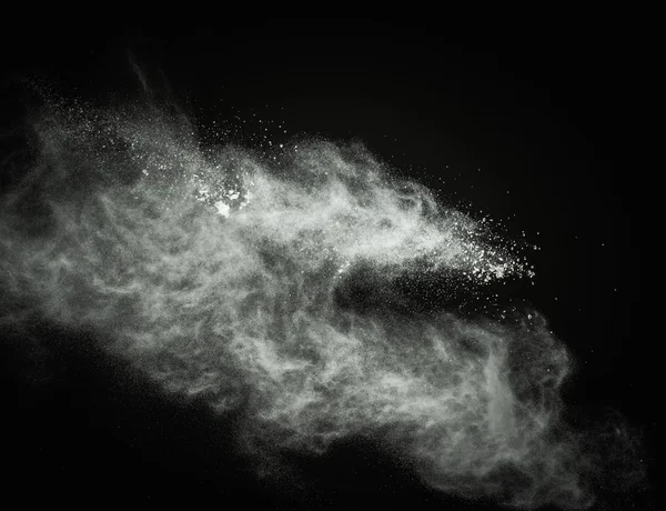 White powder exploding isolated on black — Stock Photo, Image