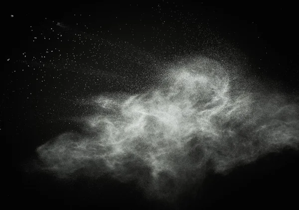 White powder exploding isolated on black — Stock Photo, Image