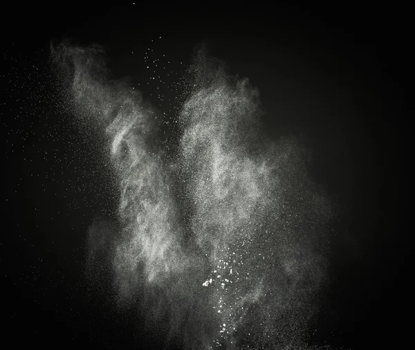 White powder exploding isolated on black — Stock Photo, Image