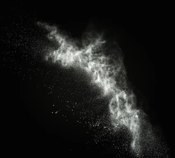 Pó branco explodindo isolado em preto — Fotografia de Stock