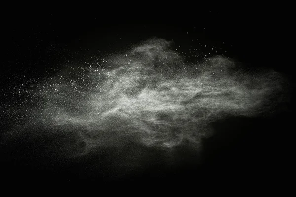 White powder exploding isolated on black — Stock Photo, Image