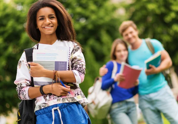 African-american girl student in a city park on summer day — Stock Photo, Image