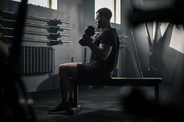 Serious Man Concentrated on Arms Workout . Stock Image