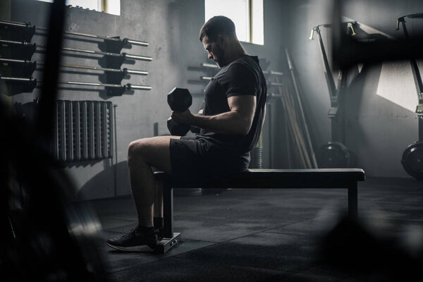 Sportsman Use Dumbbell For Workout . Stock Picture