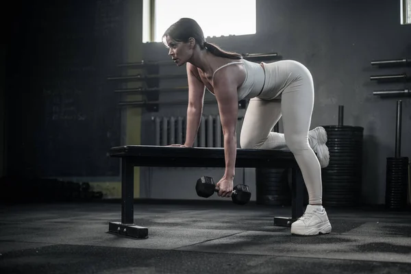 Attractive Woman in Uniform Has Training With Dumbbells . — Stock Photo, Image