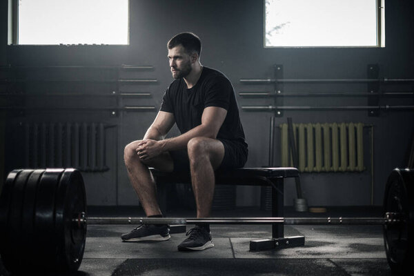 Serious Sportsman Take Break After Intensive Workout . Royalty Free Stock Images