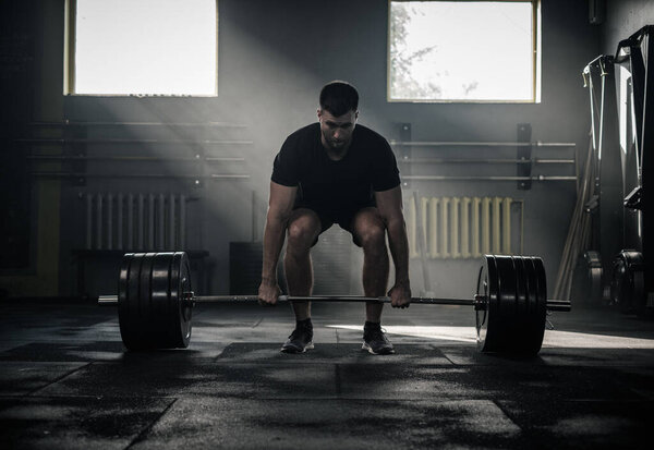 Muscular and Athletic Bodybuilder Lift Barbell . Stock Image