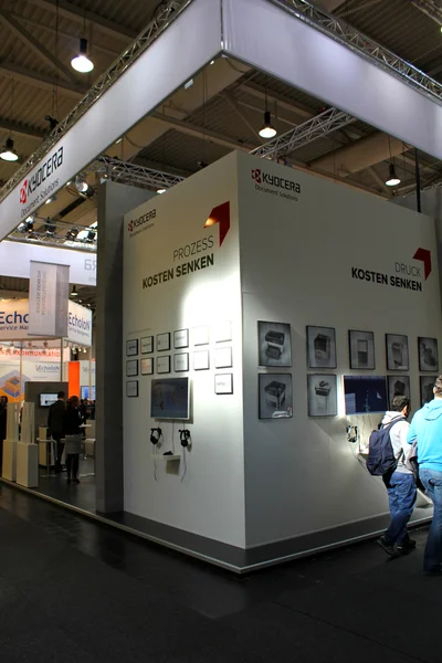 HANNOVER, GERMANY - MARCH 13: The stand of Kyocera on March 13, 2014 at CEBIT computer expo, Hannover, Germany. CeBIT is the world's largest computer expo — Stock Photo, Image