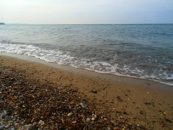 Τα κύματα στην παραλία θάλασσας — Φωτογραφία Αρχείου