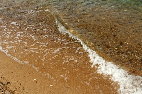 Τα κύματα στην παραλία θάλασσας — Φωτογραφία Αρχείου