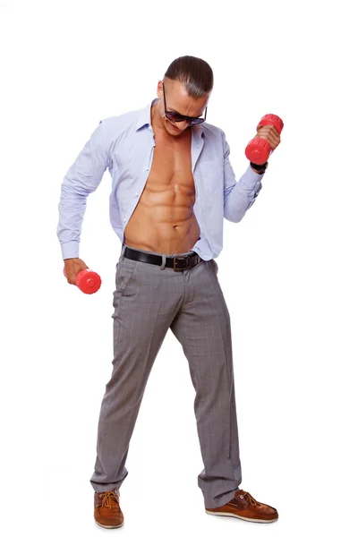 Portrait of sexy man doing exercises in gym — Stock Photo, Image