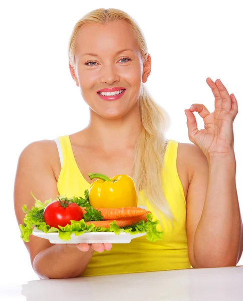 Portrait of vegetarian posing in kitchen with vegetables — Stock Photo, Image