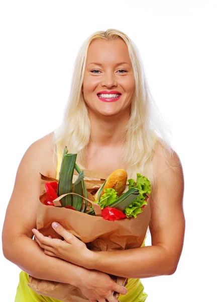 Πορτρέτο του χαμογελώντας poing γυναίκα σε στούντιο με τα τρόφιμα — Φωτογραφία Αρχείου
