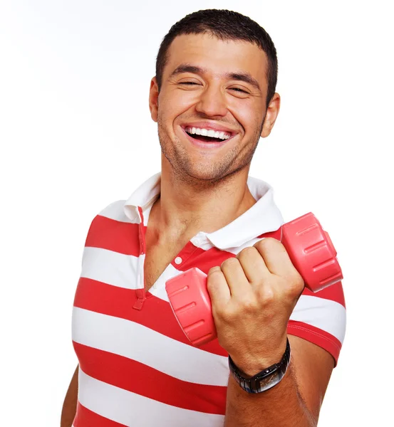 Portrait of muscle man posing in studio with dumbbells — Stock Photo, Image